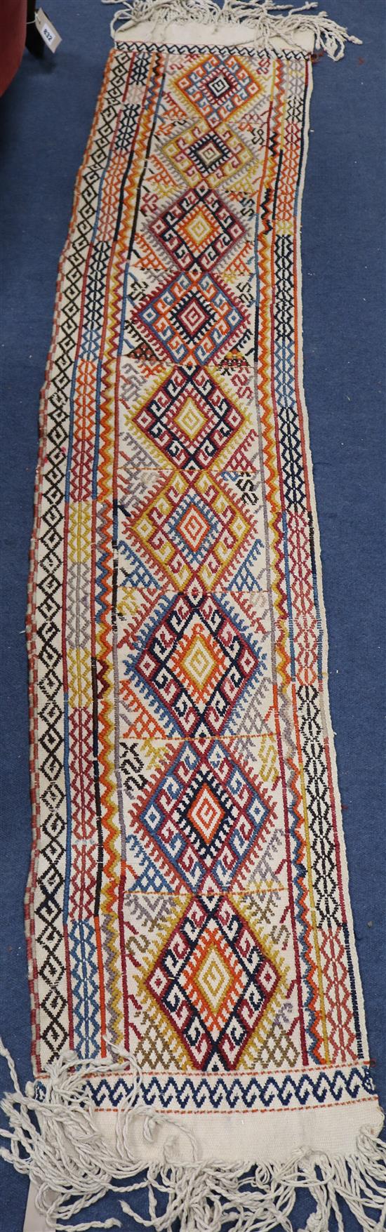 A Kelim type embroidered runner 119 x 36cm